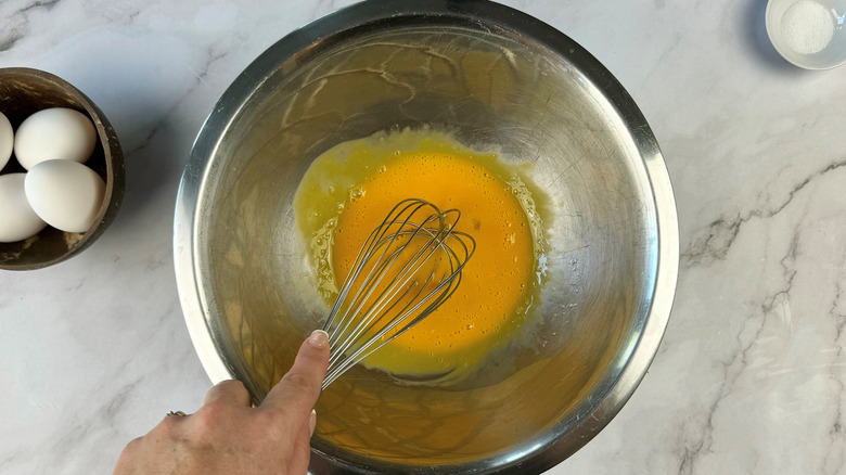 whisking lemon and yolks