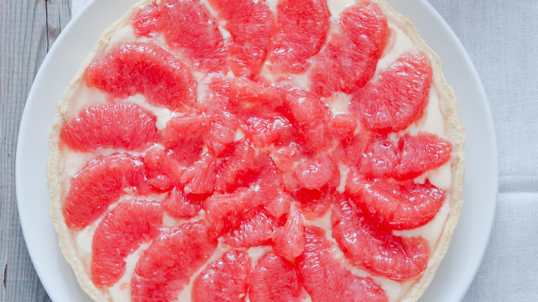 Rupy red grapefruit wedges top a pie