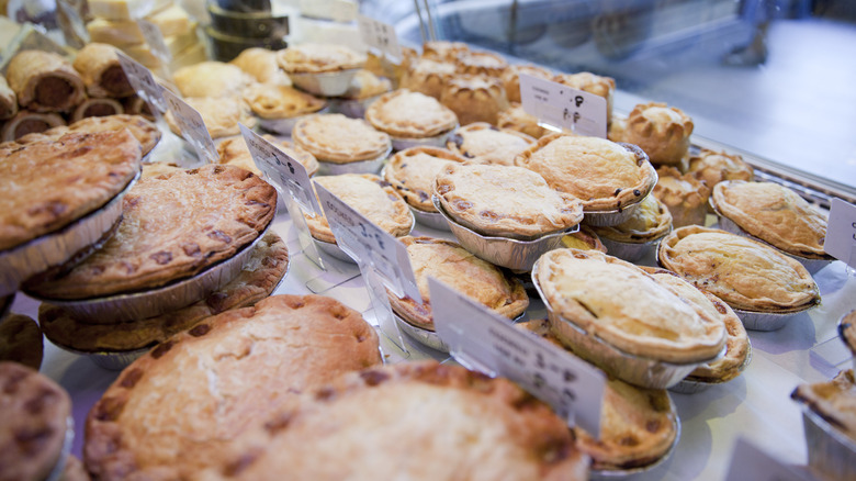 Display case loaded with different kinds of pies