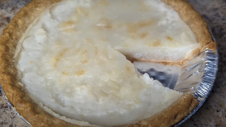 Water pie in a tin plate with a slice removed