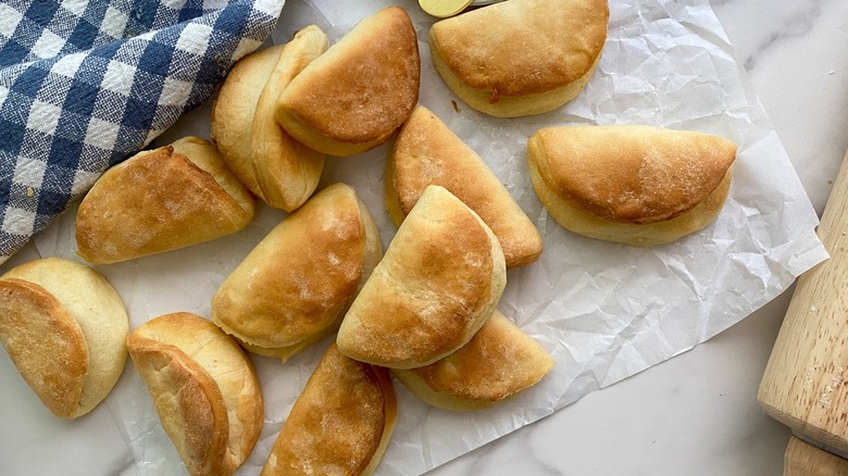 parker house rolls on parchment paper