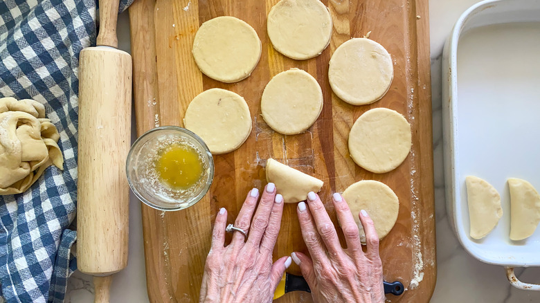 dough cut into circled folding in half