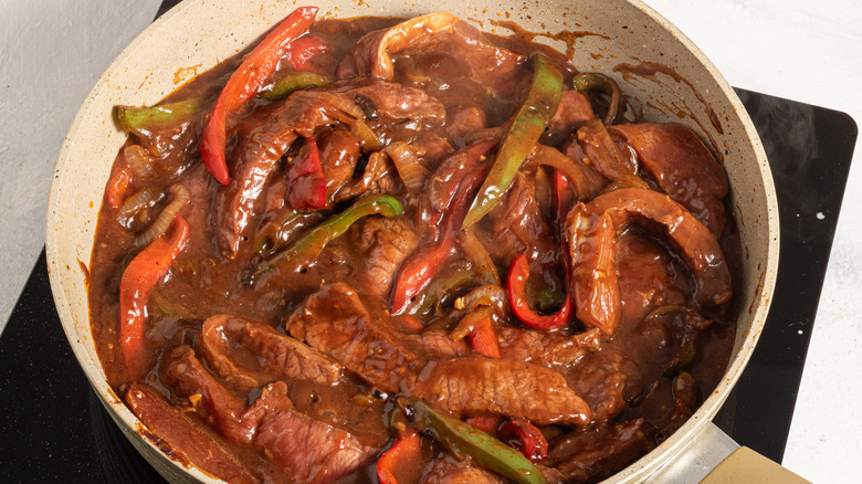 Skillet with pepper steak in a sauce