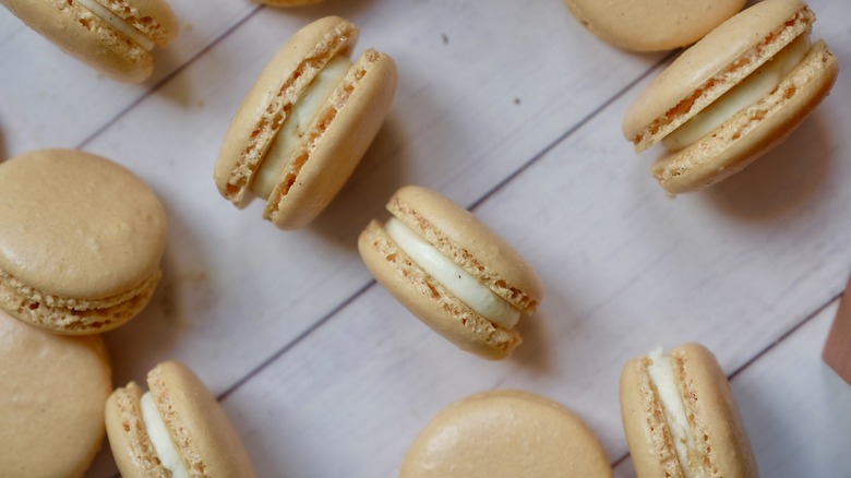 orange macarons scattered