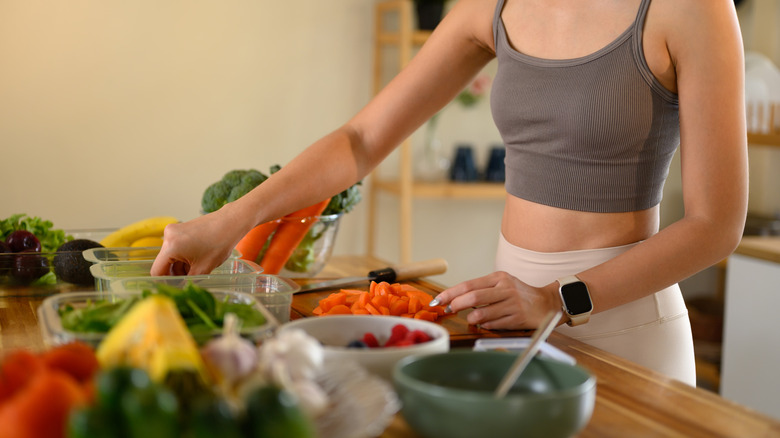Woman prepping ingredients for pre-portioned meals