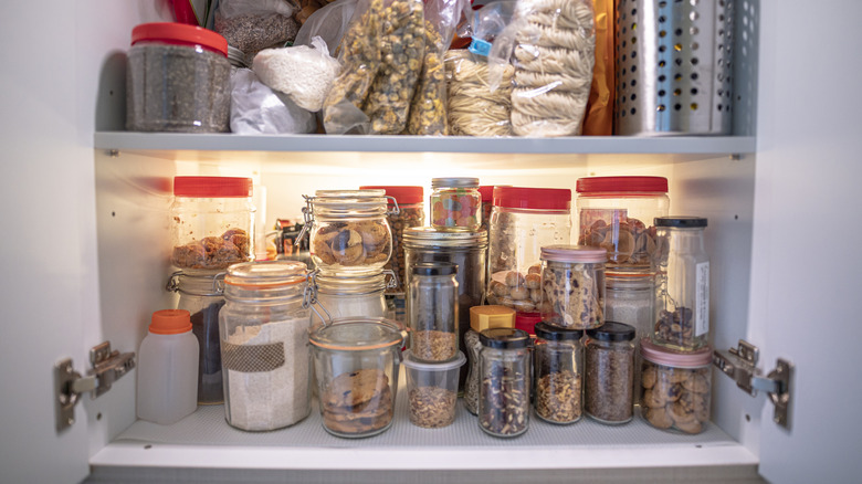 pictured cluttered spice cabinet