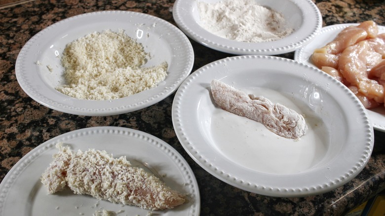 coating chicken tenders with breading