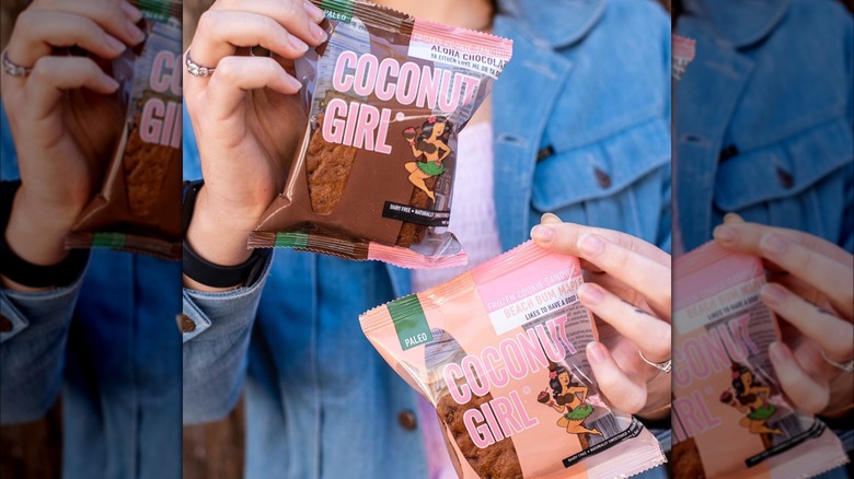 holding ice cream cookie sandwiches