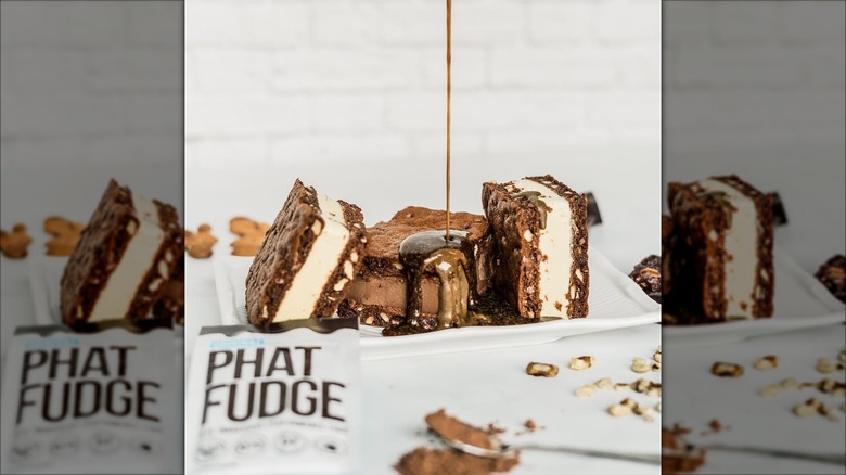 Fudge poured over ice cream cookie sandwiches