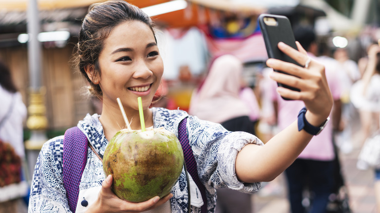 Woman enjoying coconut water