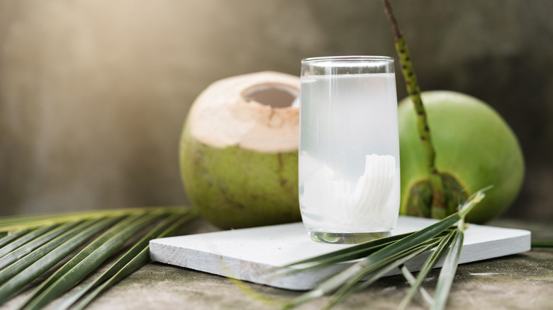 Woman drinking coconut water