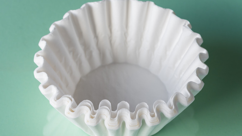 A stack of white coffee filters