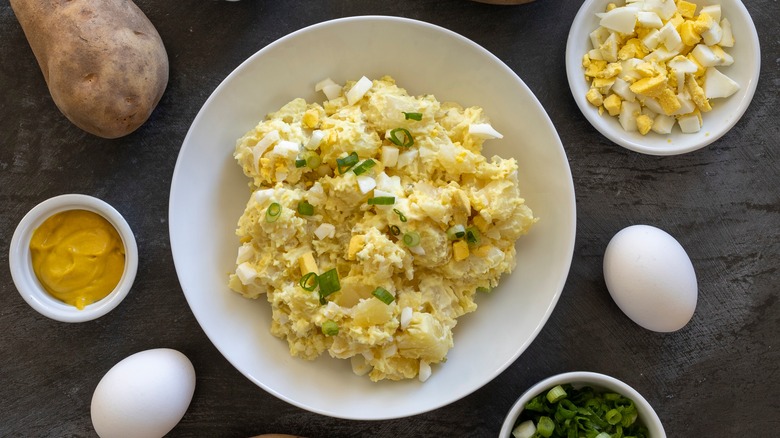 Potato salad surrounded by ingredients