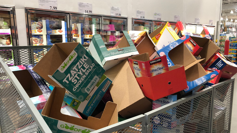 Bin of empty boxes in a Costco aisle