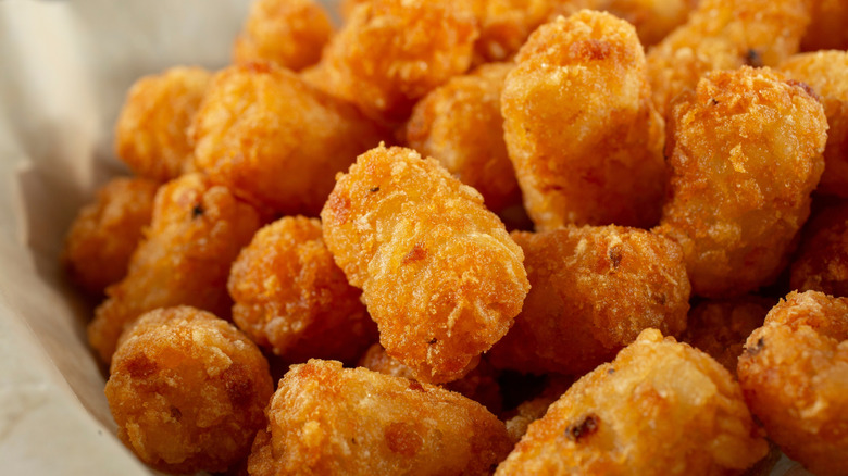 Crispy tater tots in a food basket