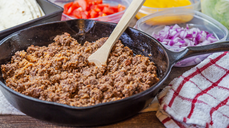Browned ground beef in a cast iron skillet