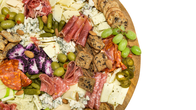 cheese board with cornichons