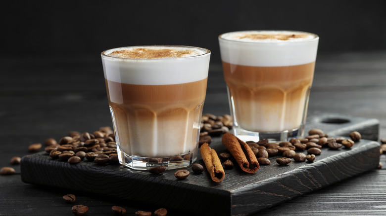 Two macchiatos in a glass.