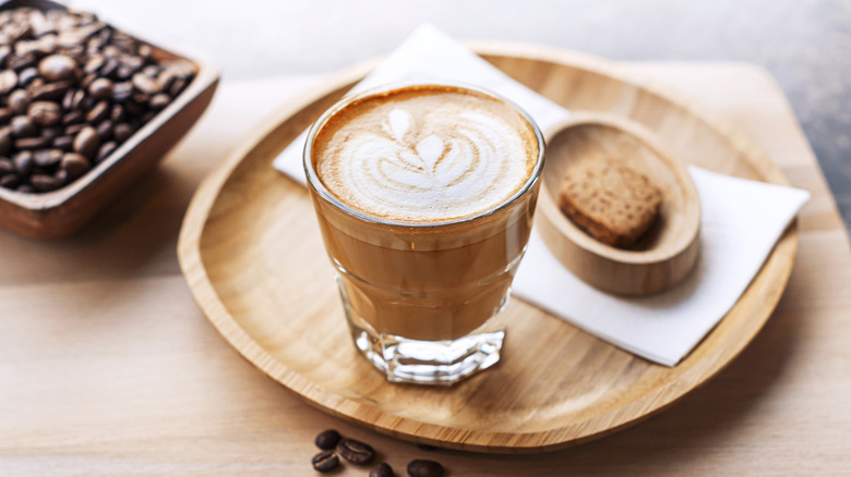 A cortado on a plate.
