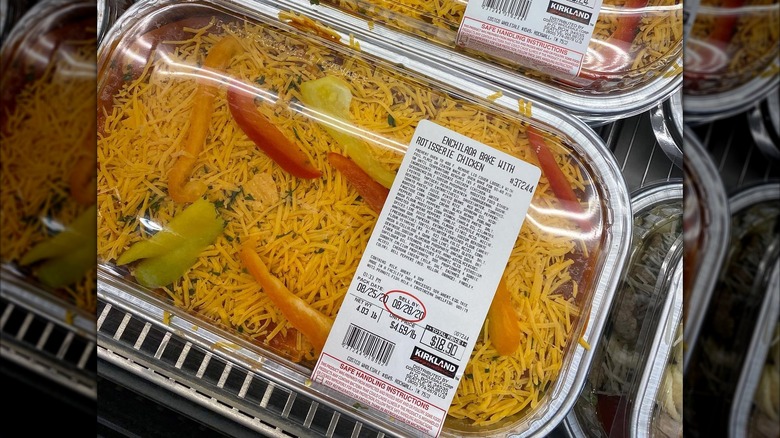A piece of enchilada bake sits on a white plate