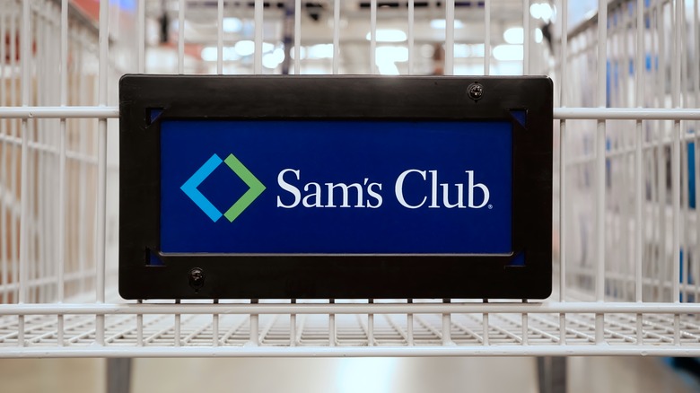 Sam's Club placard affixed to an empty shopping cart