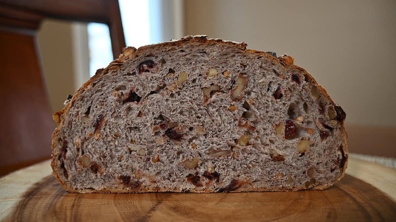 Kirkland Signature cranberry walnut bread sits on a cutting board.