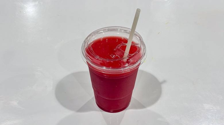 Costco strawberry banana smoothie with a straw