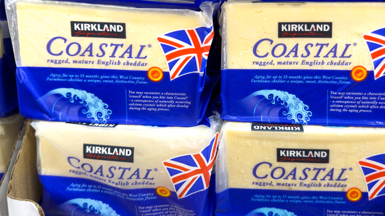 Packages of Kirkland Signature Coastal Cheddar Cheese on display