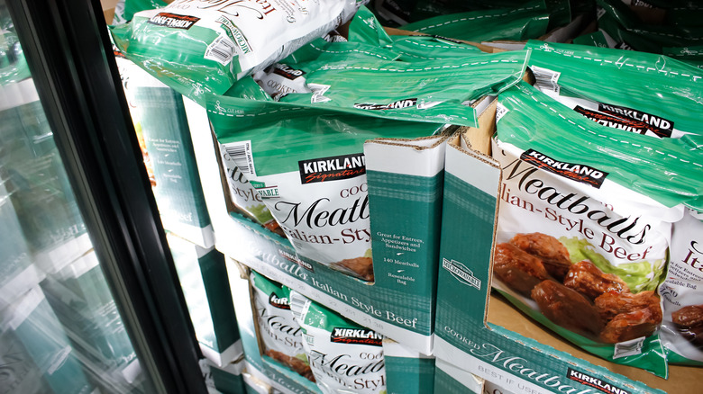 Bags of Kirkland Signature Frozen Italian-Style Meatballs in the freezer section at Costco