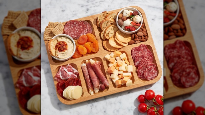 Charcuterie board with assorted meat, cheese, crackers, and more
