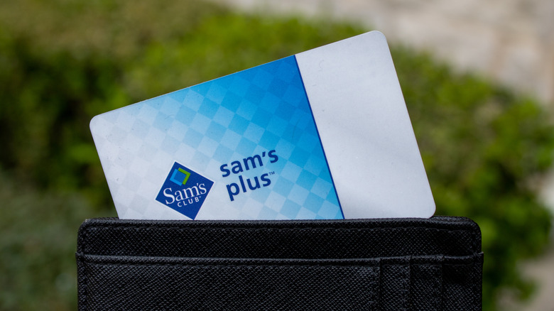 Sam's Club membership card sticking out of black leather wallet