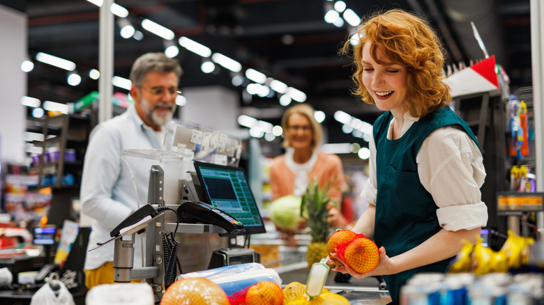A smiling cashier.