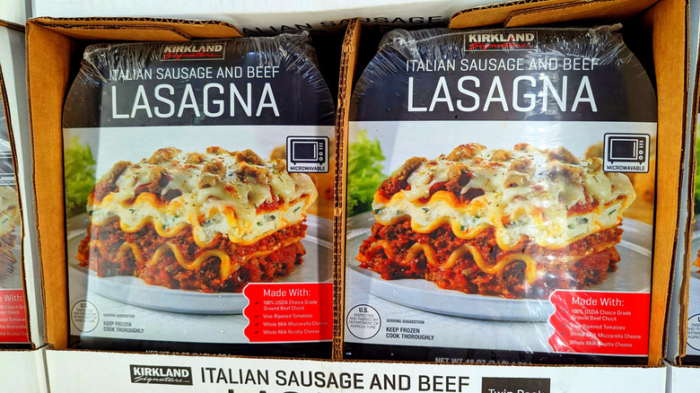 Containers of ready-to-cook Kirkland brand Italian sausage and beef lasagna
