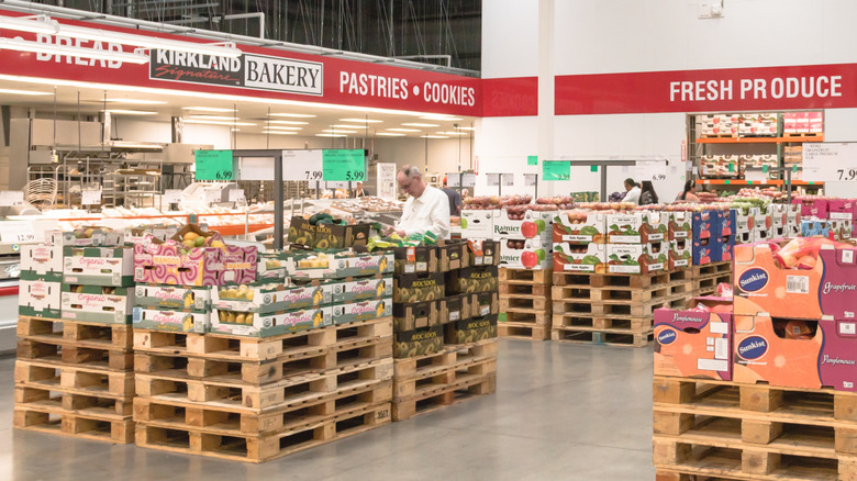A man examines an item in the Costco bakery department
