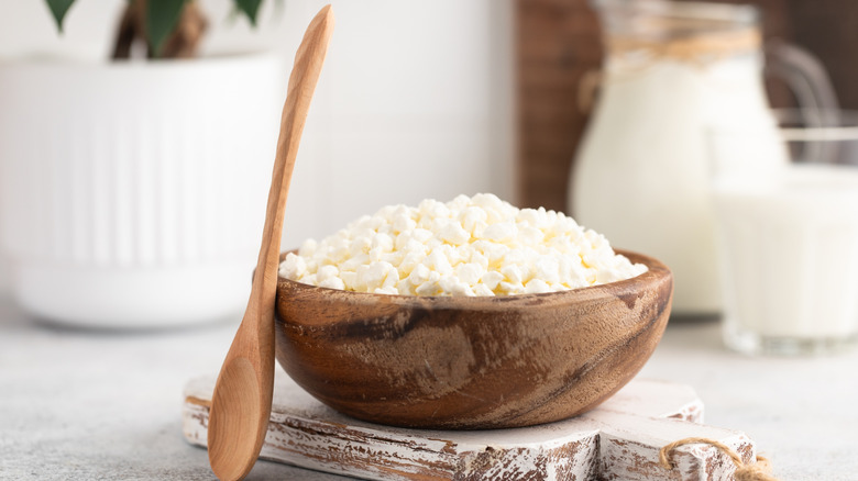 Wooden bowl full of cottage cheese