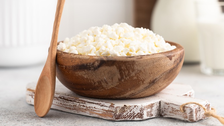 Wooden bowl of cottage cheese