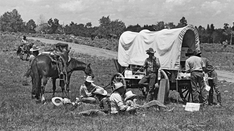 Cowboys eating on the drive.