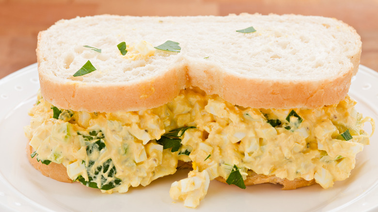 Close up of creamy egg salad sandwich