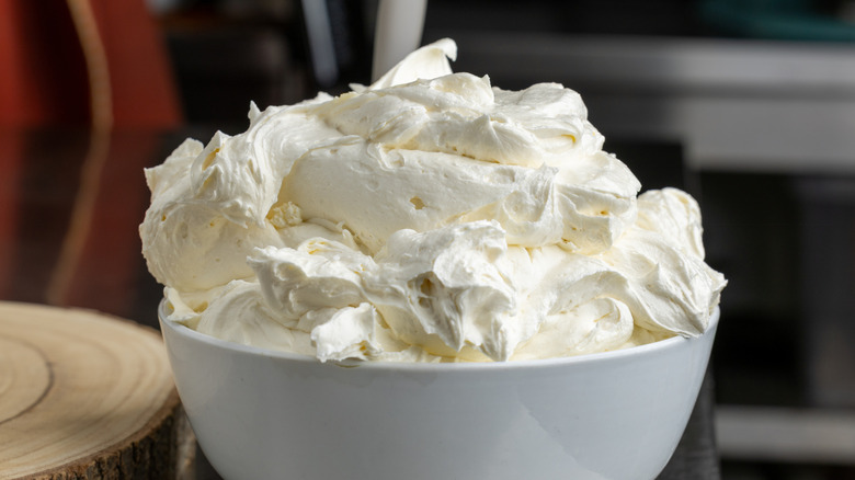 White bowl full of freshly made whipped cream