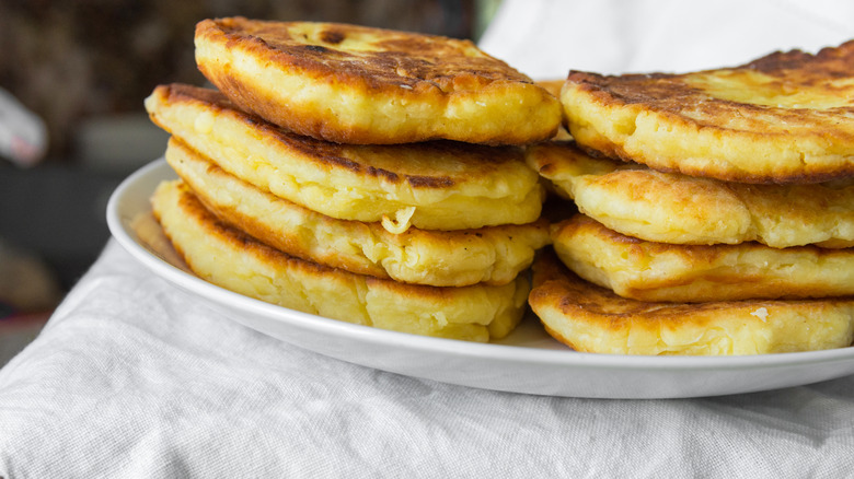 Stacks of fluffy pancakes on a white plate