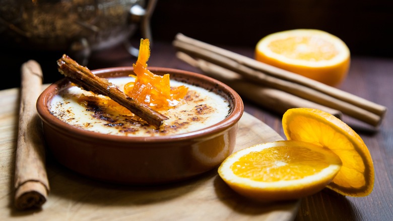 Crema Catalana garnished with lemon peel and cinnamon stick