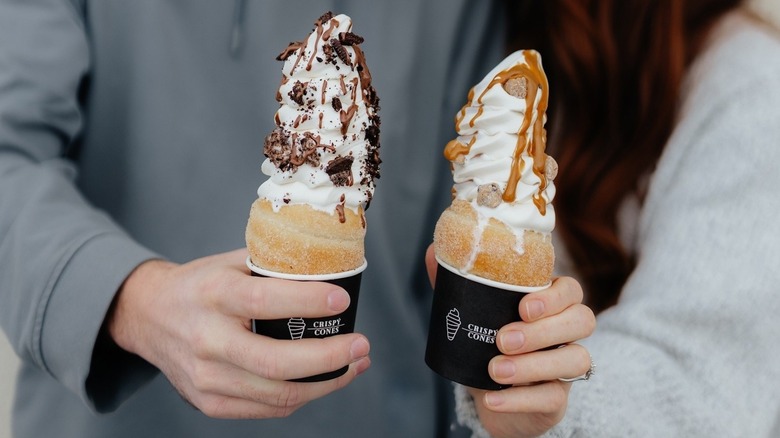 People holding two Crispy Cones