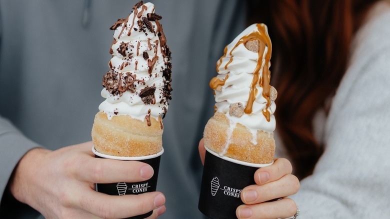People holding two Crispy Cones