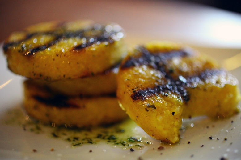 Pre-made polenta from the store gets tasty with a drizzle of oil and some time on the grill