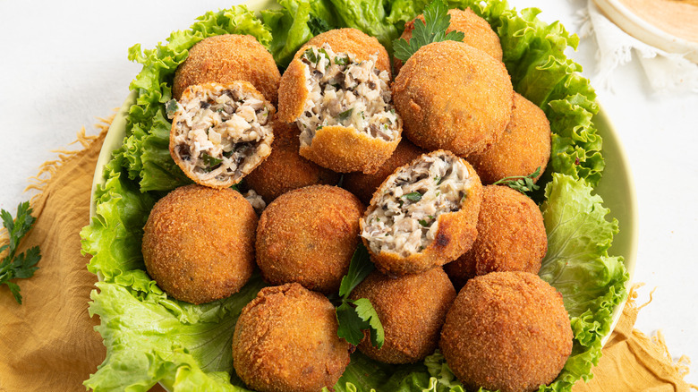 fried turkey croquettes on lettuce