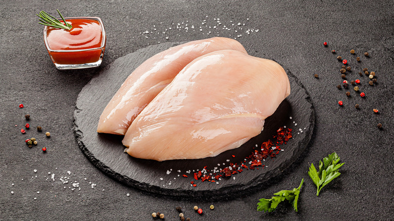 Large chicken breasts on slate