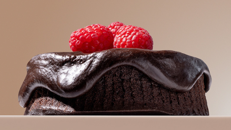 Kourtney's Flourless Chocolate Cake for Crumbl sits against a neutral background