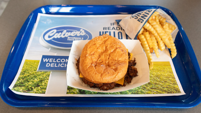 Culver's butter burger with cheese and crinkle-cut fries on a signature Culver's blue tray