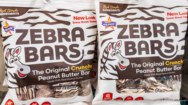 Packages of Zebra Bars featuring Zebra mascot.