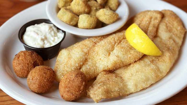 Cracker Barrel's Fried Catfish with hushpuppies, fried okra, tartar sauce, and a lemon slice